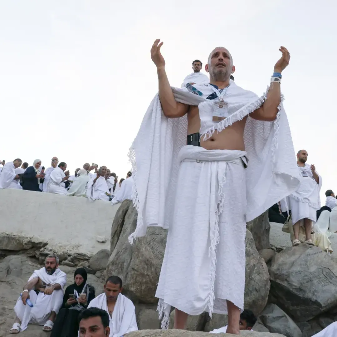 Pilgrim making dua near Mount Arafat during Hajj